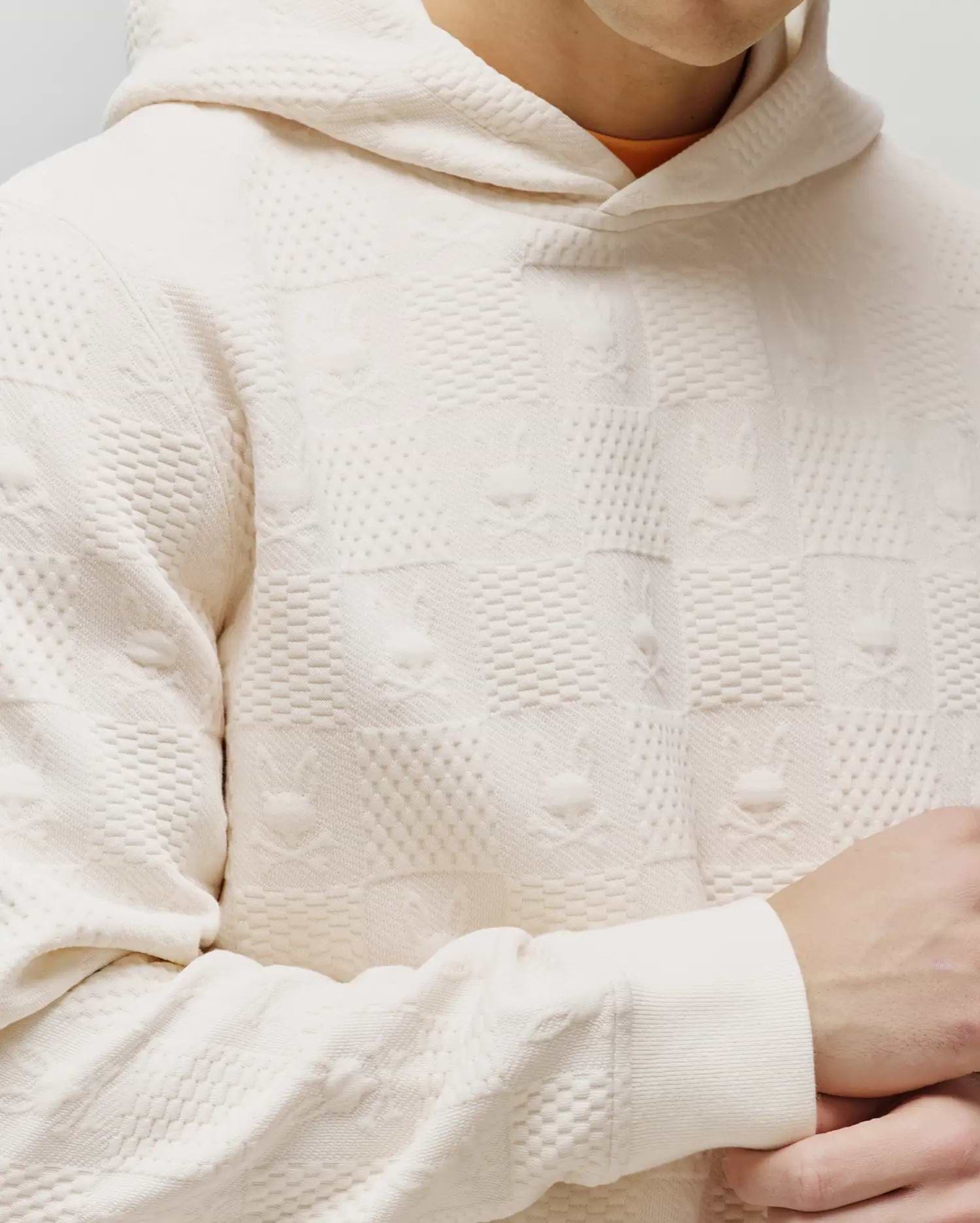 Cream Mens Dustin Hoodie, classic fit, with an all-over textured jacquard checkerboard pattern featuring embossed small Psycho Bunny skull logos.