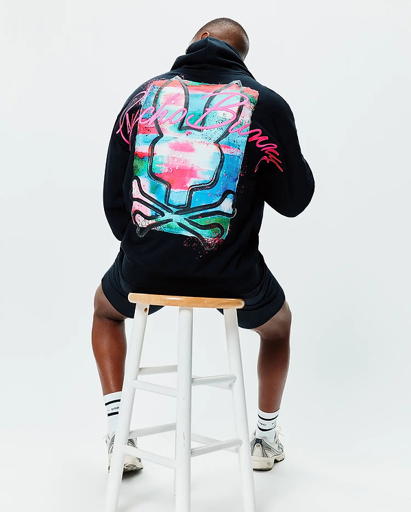 Mens Isaac Print Hoodie, black, relaxed fit, with a large vibrant paint-splatter bunny skull graphic on the back in pink, blue, green, and white, featuring neon pink Psycho Bunny text.