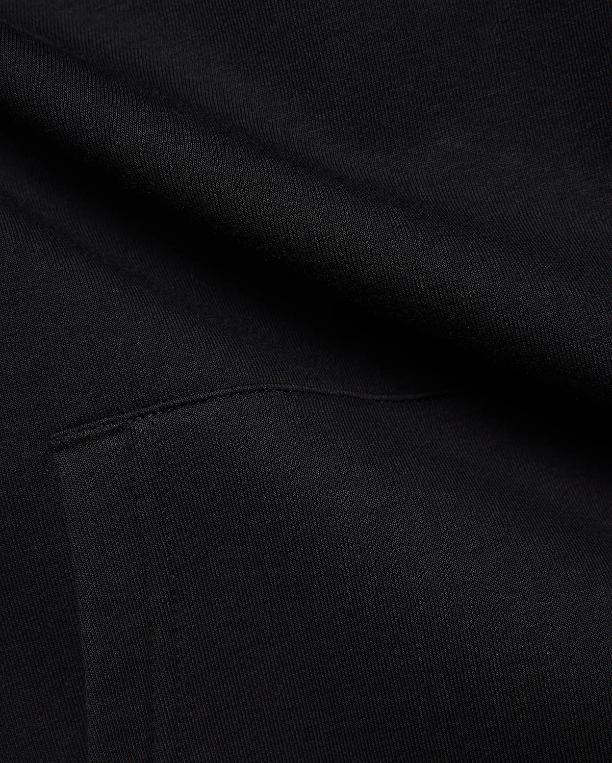 Black MENS ISAAC PRINT HOODIE in soft French terry knit, featuring subtle diagonal texture and a visible seam detail, hinting at a signature Psycho Bunny graphic print.