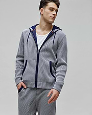 Mens Maxton Waffle Full Zip Hoodie in navy and white waffle knit, featuring a classic fit, full zip, drawstring hood with orange accents, front pockets, and a small embroidered Psycho Bunny skull logo on the left chest.
