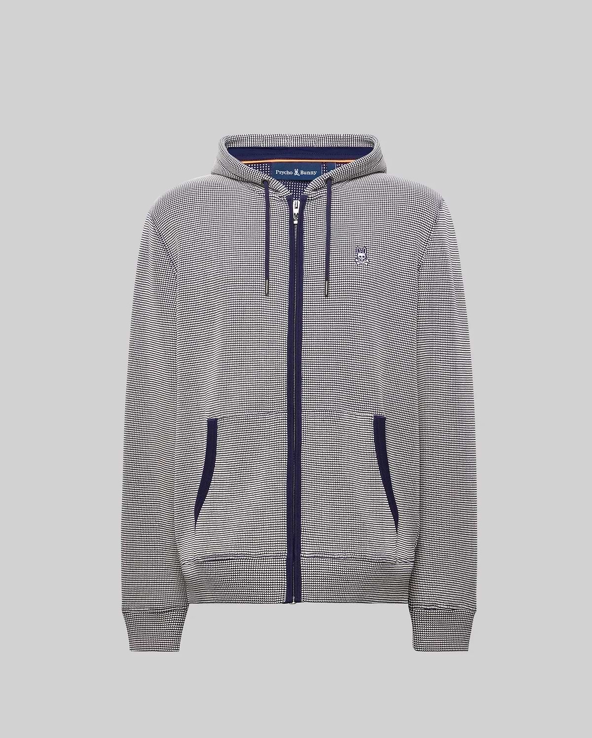 Mens Maxton Waffle Full Zip Hoodie in navy and white micro-check pattern, featuring a classic fit, full navy zip, drawstrings, and pocket trim, with a small embroidered Psycho Bunny skull logo on the left chest.