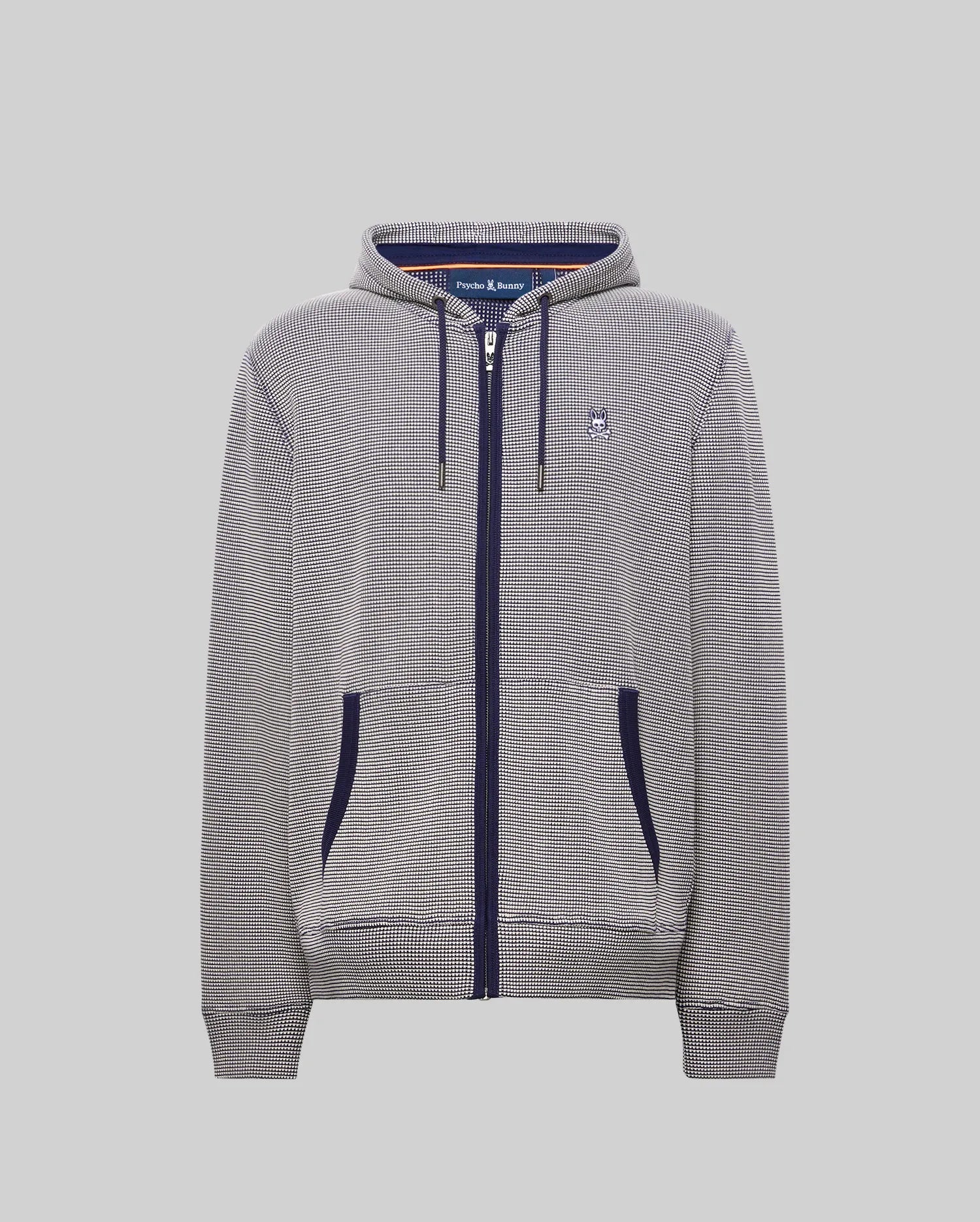 Mens Maxton Waffle Full Zip Hoodie in navy and white micro-check pattern, featuring a classic fit, full navy zip, drawstrings, and pocket trim, with a small embroidered Psycho Bunny skull logo on the left chest.