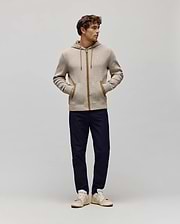 Mens Maxton Waffle Full Zip Hoodie in beige waffle knit, featuring a classic fit, brown zipper, drawstrings, pocket trim, and a small embroidered Psycho Bunny skull logo on the left chest.
