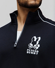 Mens Toby 1/4 Zip, a black classic fit smooth knit pullover with a stand-up collar, white shoulder piping, and a large white embroidered Psycho Bunny skull logo on the left chest, featuring a branded zipper pull.
