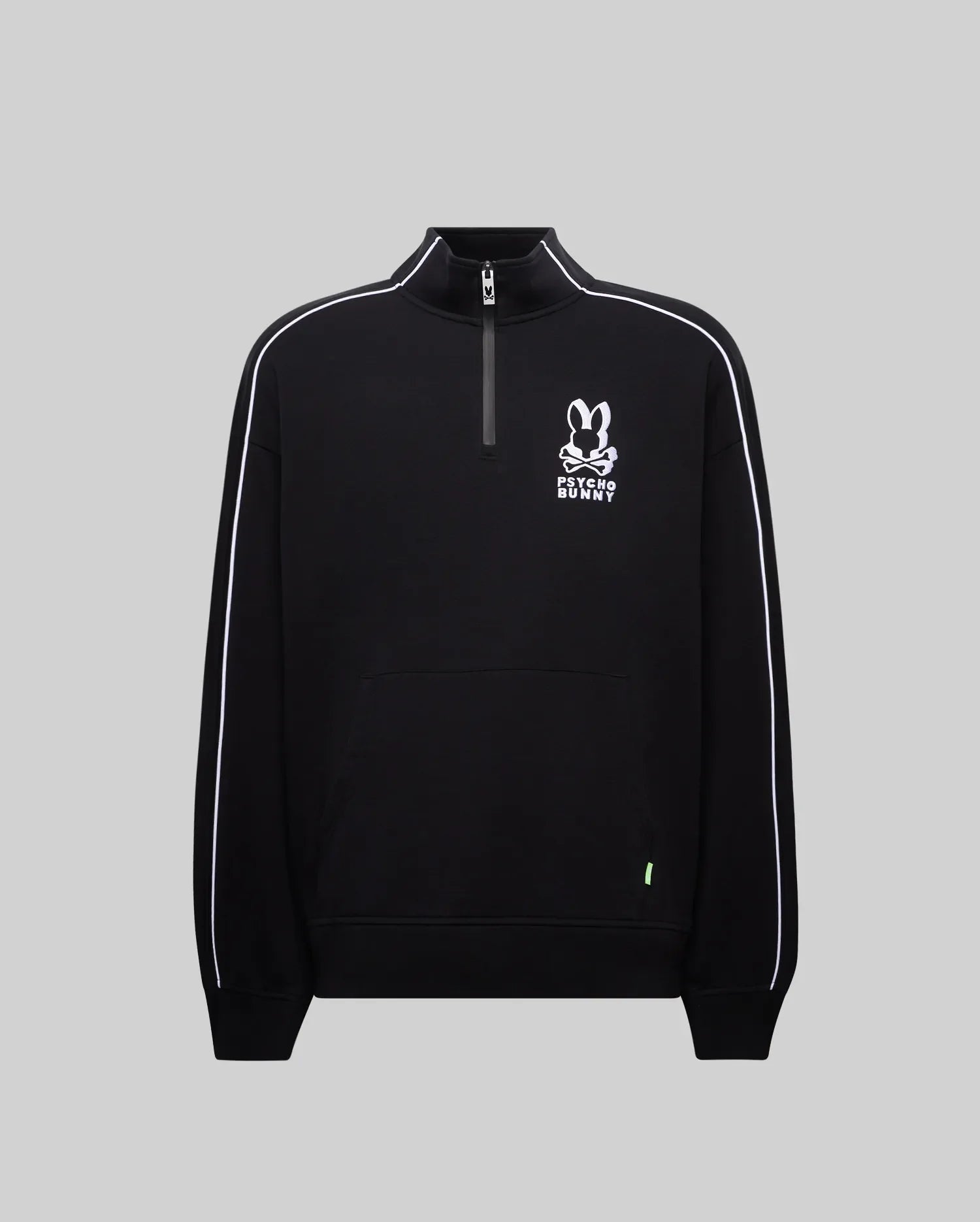 Mens Toby 1/4 Zip, a black relaxed-fit smooth knit pullover with a stand collar, white piping on sleeves, a kangaroo pocket, and a prominent white embroidered Psycho Bunny skull and crossbones logo on the chest, accented by a neon green tag.
