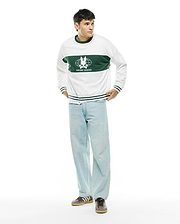 Mens Mike French Terry Crew. White relaxed-fit sweatshirt with a wide green chest stripe featuring a large white Psycho Bunny skull globe logo and text, plus green ribbed trim with white stripes.