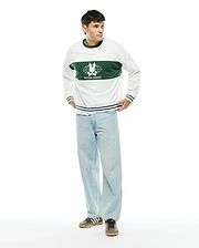 Mens Mike French Terry Crew. White relaxed-fit sweatshirt with a wide green chest stripe featuring a large white Psycho Bunny skull globe logo and text, plus green ribbed trim with white stripes.