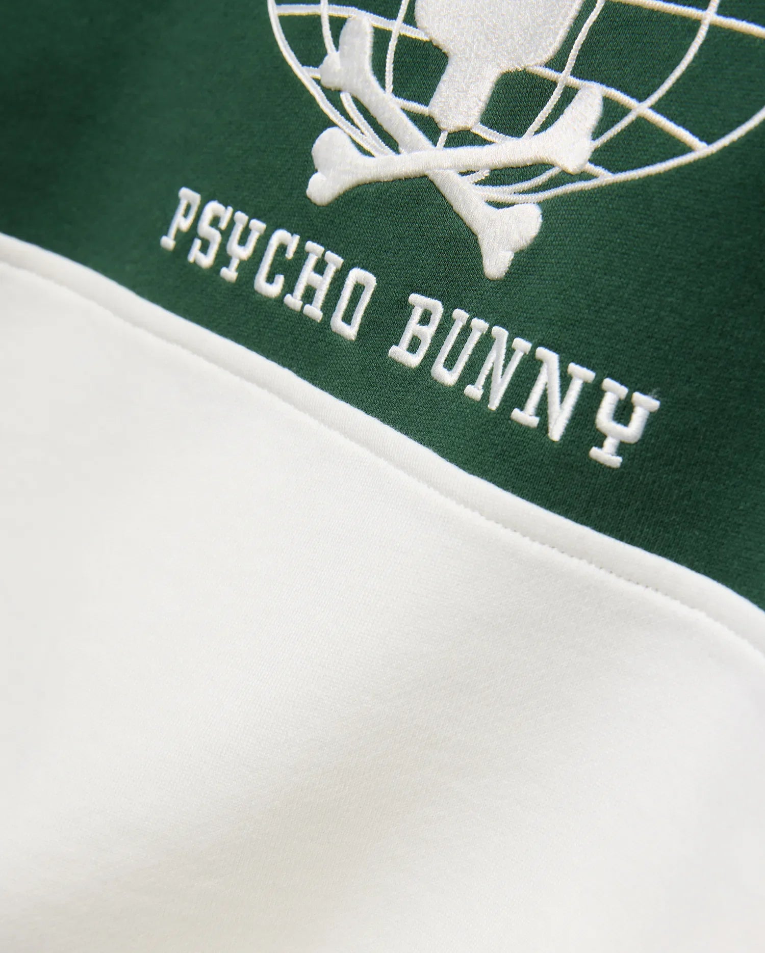 Mens Mike French Terry Crew in dark green and white color-block, featuring a large embroidered white Psycho Bunny skull and crossbones globe logo with PSYCHO BUNNY text.