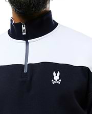 Mens Gabe French Terry 1/4 Zip in a classic fit, featuring a navy and white color block design, soft French terry fabric, and an embroidered white Psycho Bunny skull logo on the left chest, with a branded zipper pull.