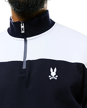 Mens Gabe French Terry 1/4 Zip in a classic fit, featuring a navy and white color block design, soft French terry fabric, and an embroidered white Psycho Bunny skull logo on the left chest, with a branded zipper pull.