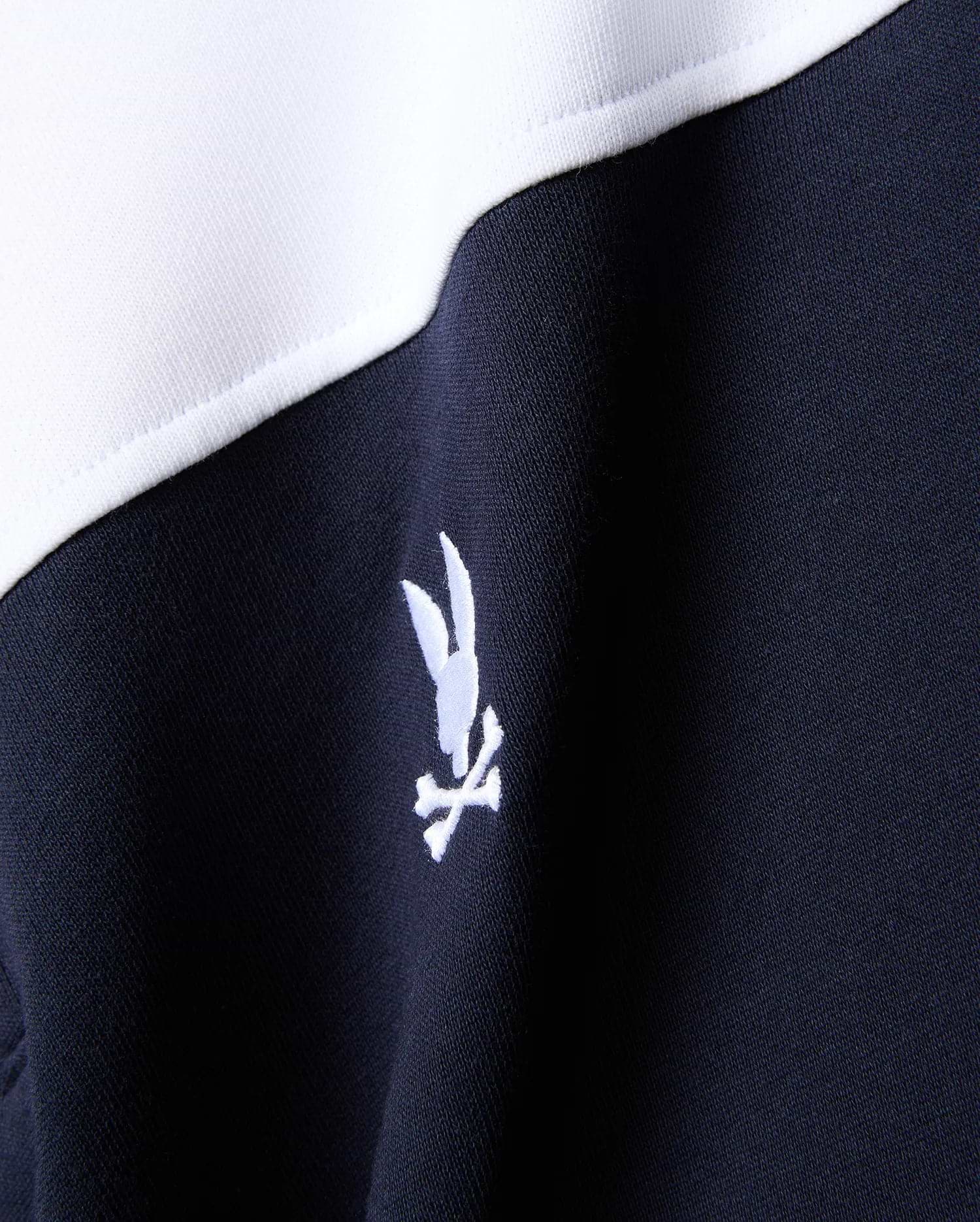 Mens Gabe French Terry 1/4 Zip in navy and white color-block, featuring a small white embroidered Psycho Bunny skull logo on the chest.