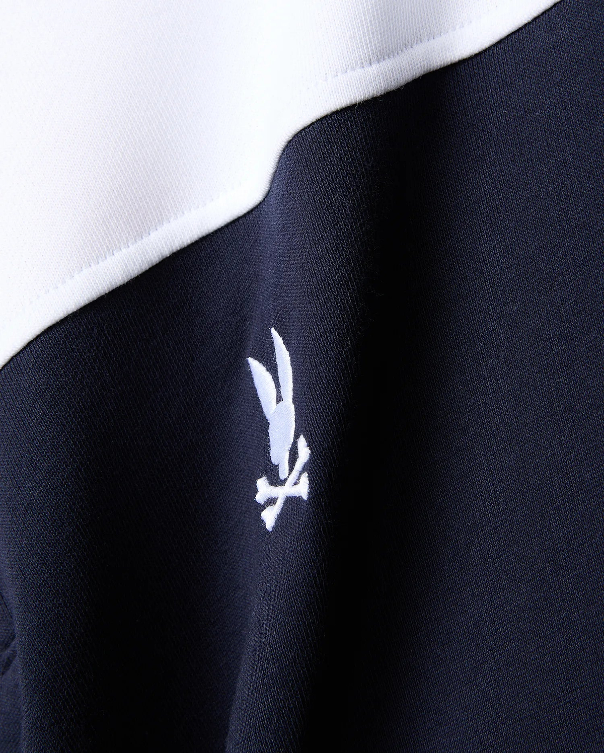 Mens Gabe French Terry 1/4 Zip in navy and white color-block, featuring a small white embroidered Psycho Bunny skull logo on the chest.