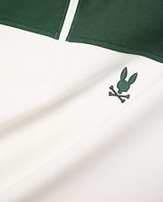 Mens Gabe French Terry 1/4 Zip, a white and dark green color-block design with a small, embroidered dark green Psycho Bunny skull logo on the chest. Soft French terry fabric.