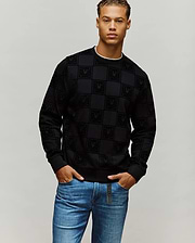 Black Mens Gio All Over Flock Crew, a classic fit crewneck sweatshirt with an all-over flocked checkered pattern featuring the Psycho Bunny skull logo, and a subtle white inner collar trim.