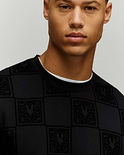 Black Mens Gio All Over Flock Crew sweatshirt, classic fit, featuring an all-over flocked Psycho Bunny logo and text checkerboard pattern on smooth jersey fabric.