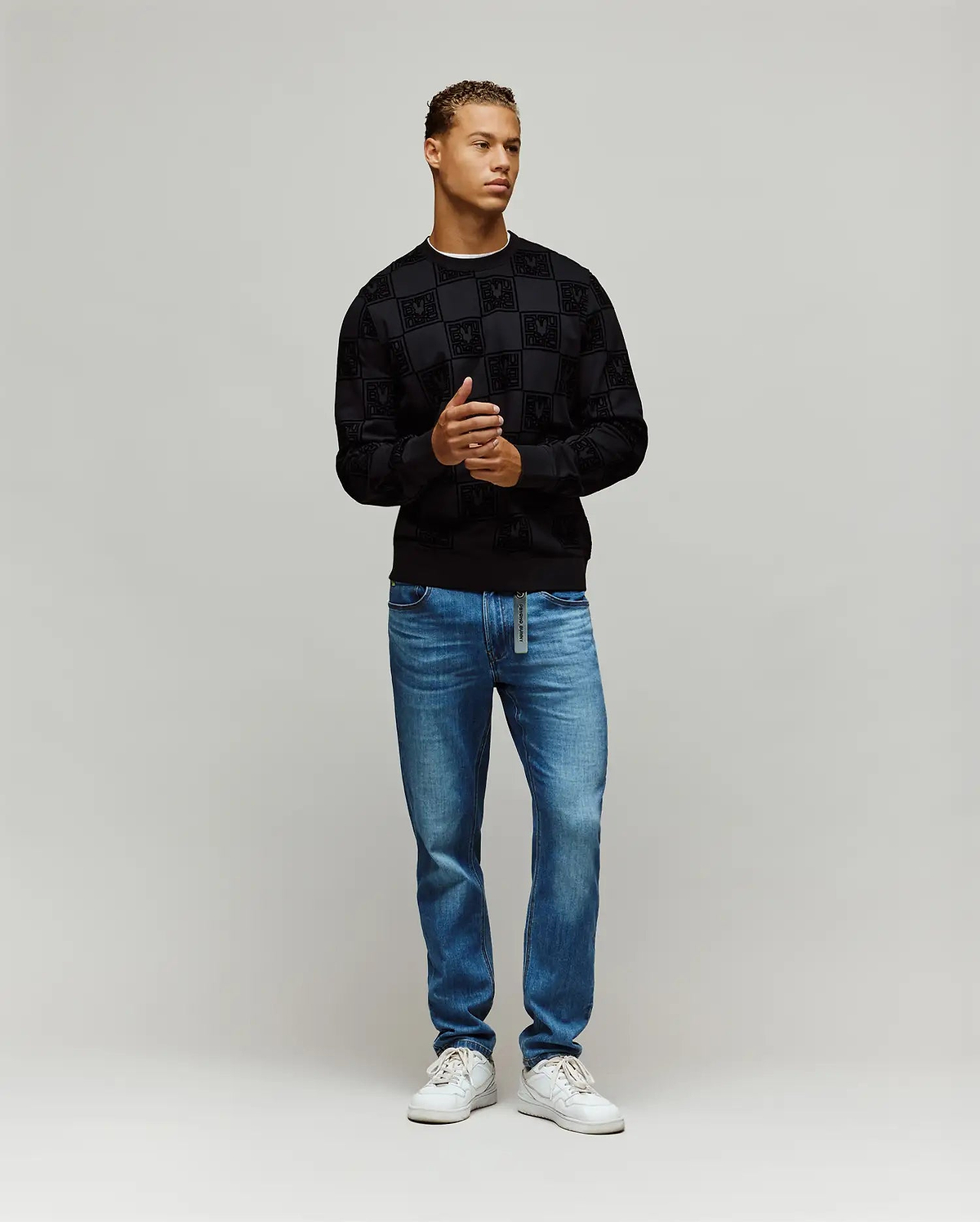 Black Mens Gio All Over Flock Crew sweatshirt with a classic fit, featuring an all-over flocked checkerboard pattern incorporating the iconic Psycho Bunny skull logo.