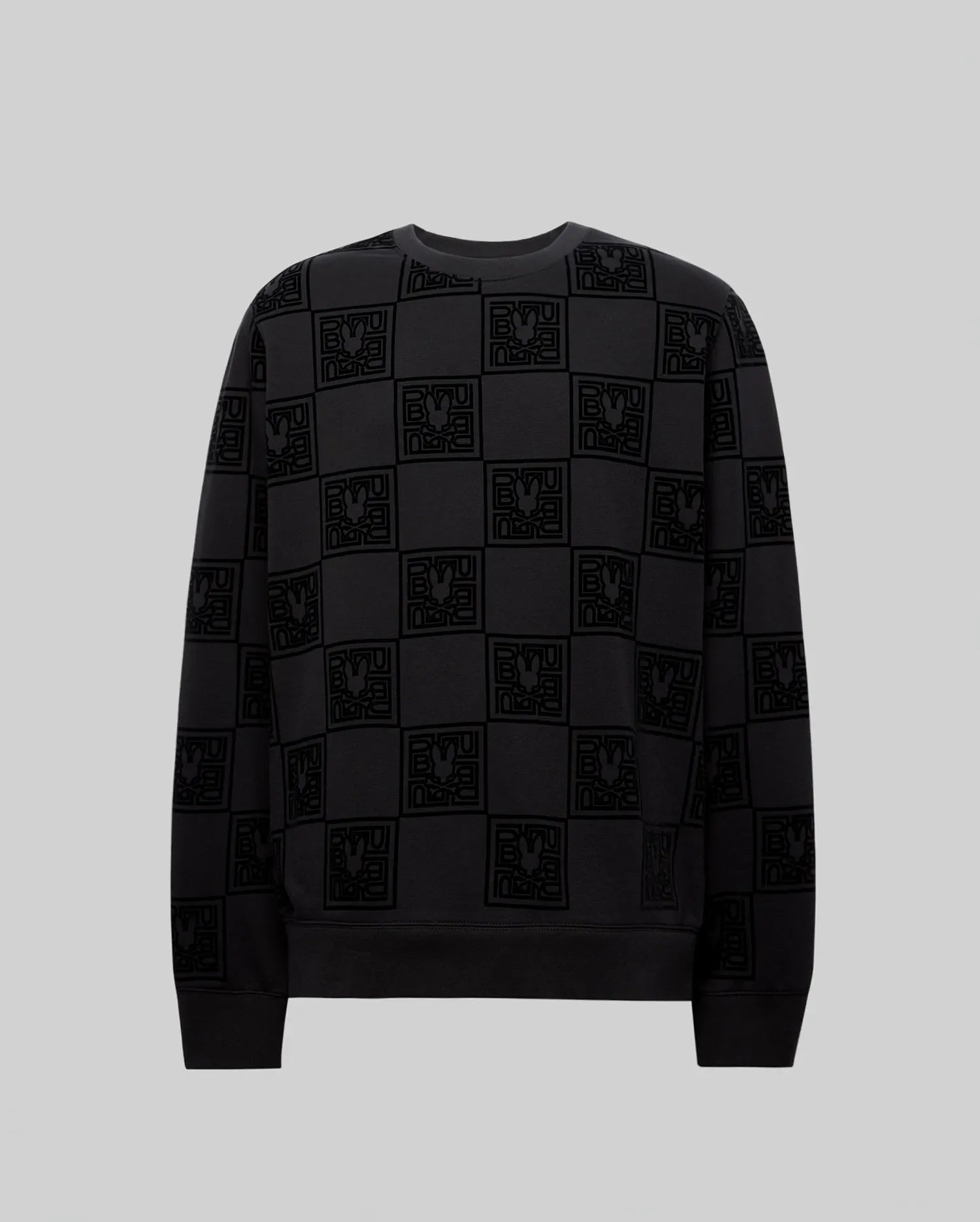 Mens Gio All Over Flock Crew, a black relaxed-fit jersey crewneck sweatshirt featuring an all-over tonal flocked checkerboard pattern of the iconic Psycho Bunny skull logo and stylized text.