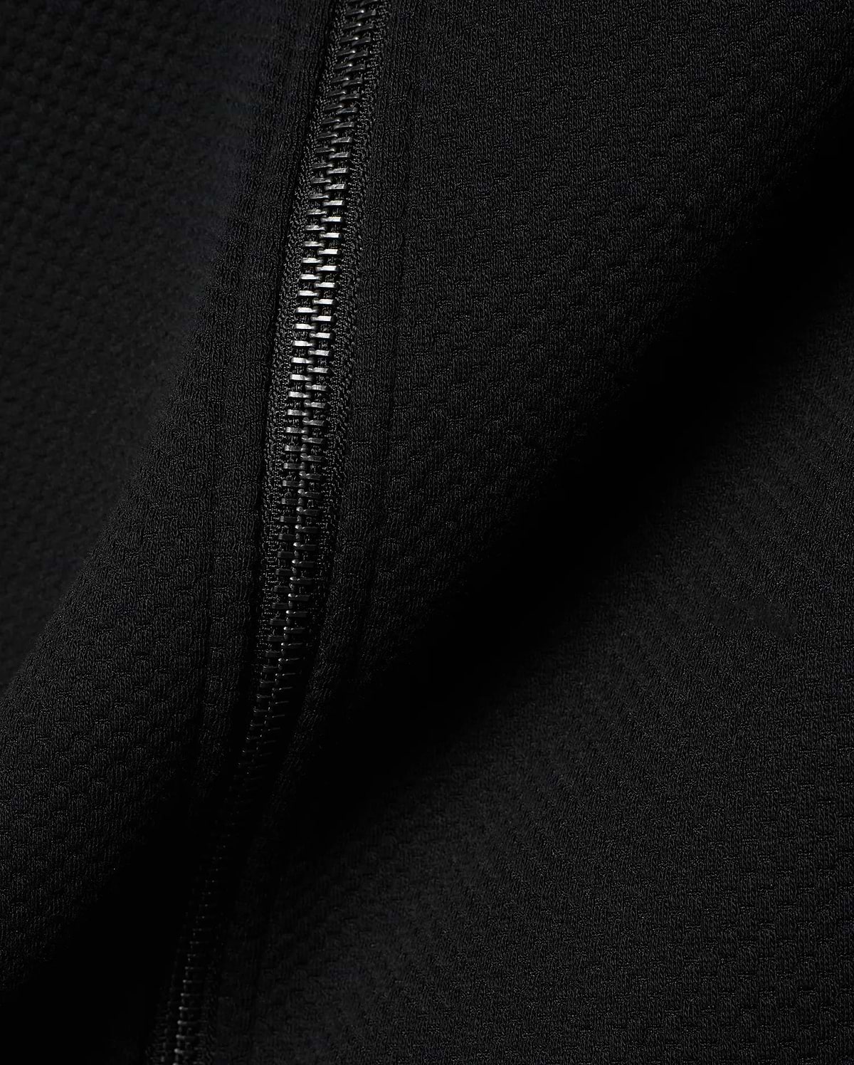 Mens Marc Textured Full Zip Hoodie in deep black, showcasing its refined waffle knit fabric texture and a sleek, dark metallic full-length zipper detail.