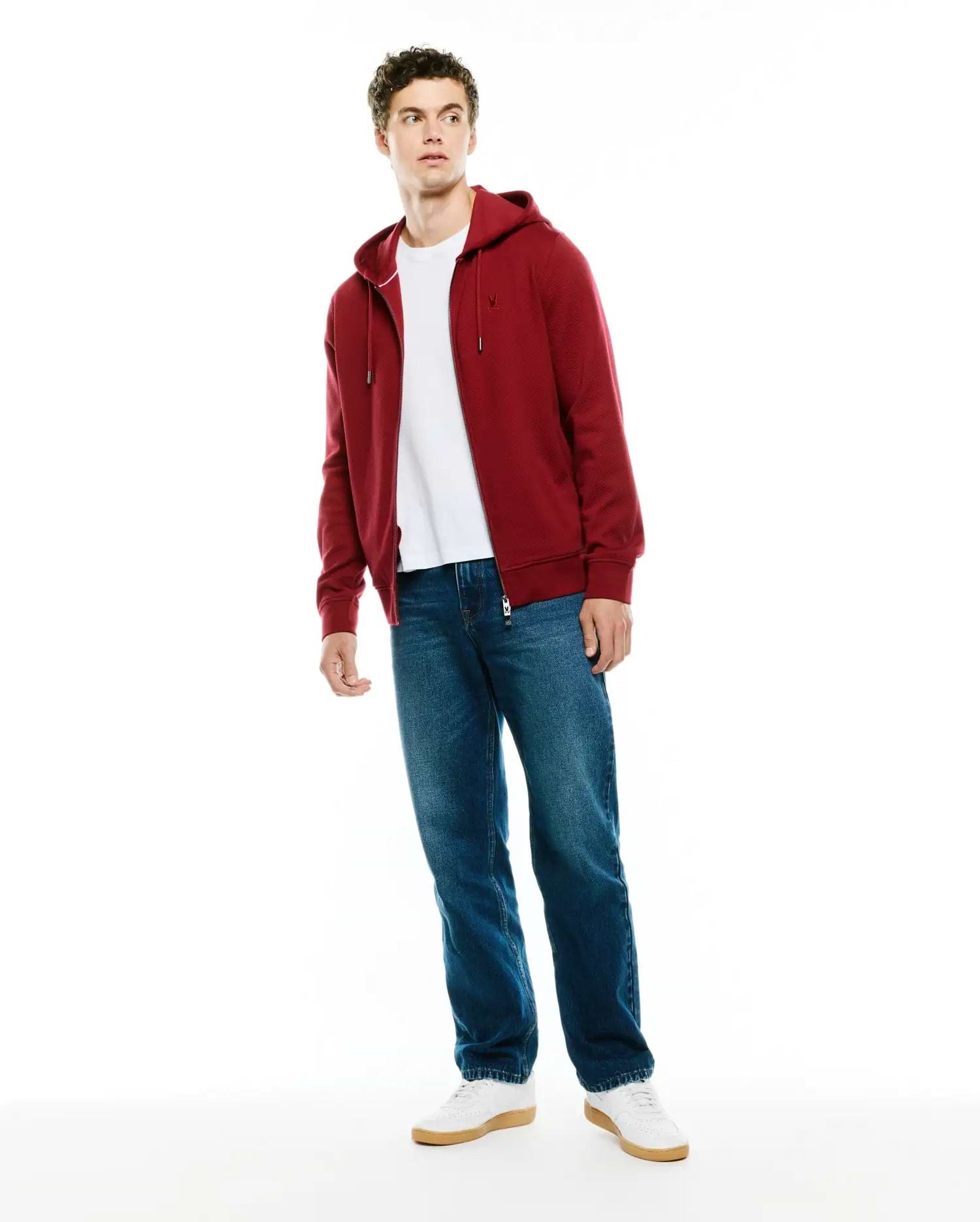 Mens Marc Textured Full Zip Hoodie in deep red, featuring a classic fit, subtle textured knit fabric, full zip closure with gold hardware, and a small embroidered Psycho Bunny skull logo on the left chest.
