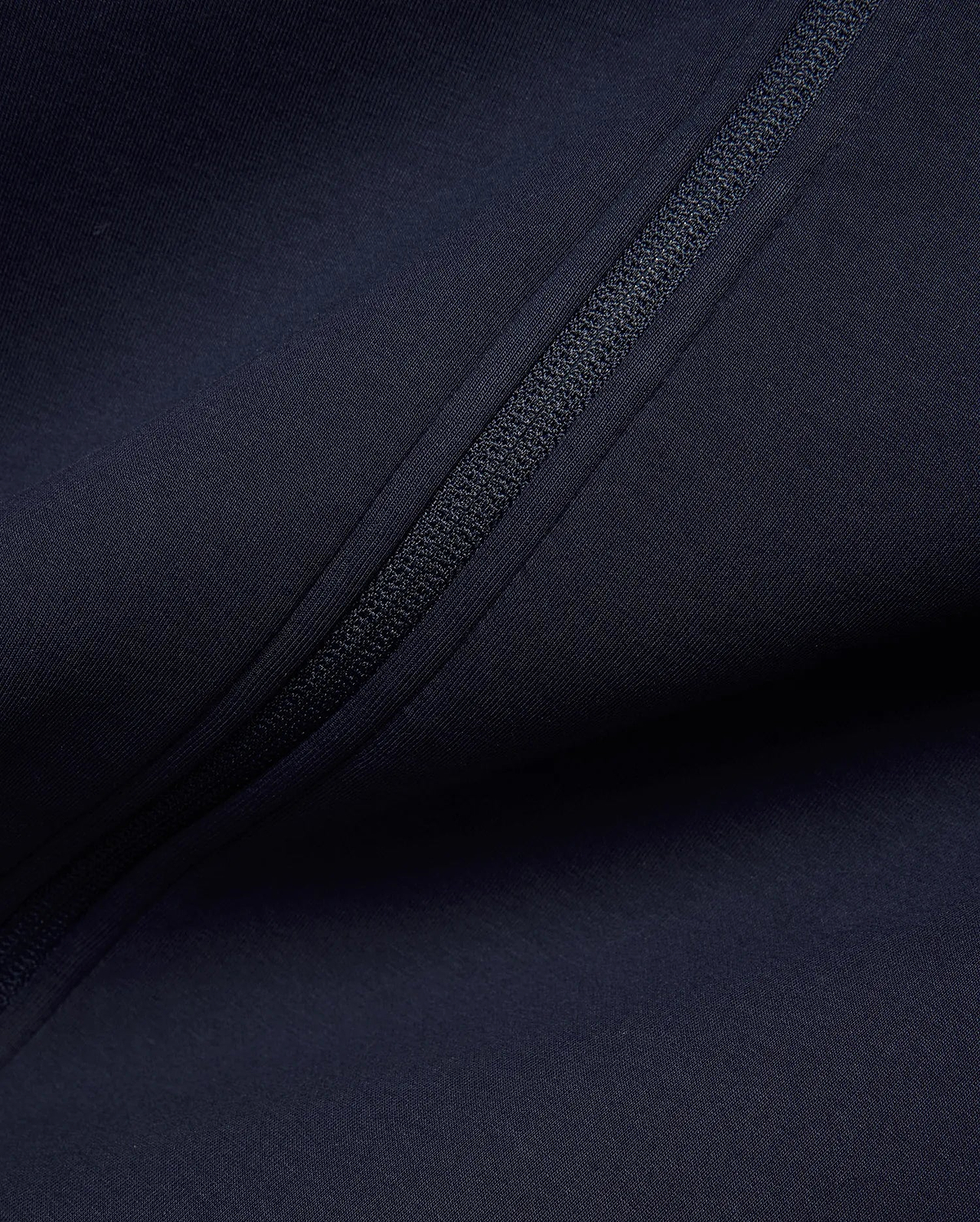 Mens Jaydon Track Jacket in deep navy, crafted from a smooth, performance-ready knit fabric, featuring a sleek, tonal full-zip closure for a refined streetwear look. (6)