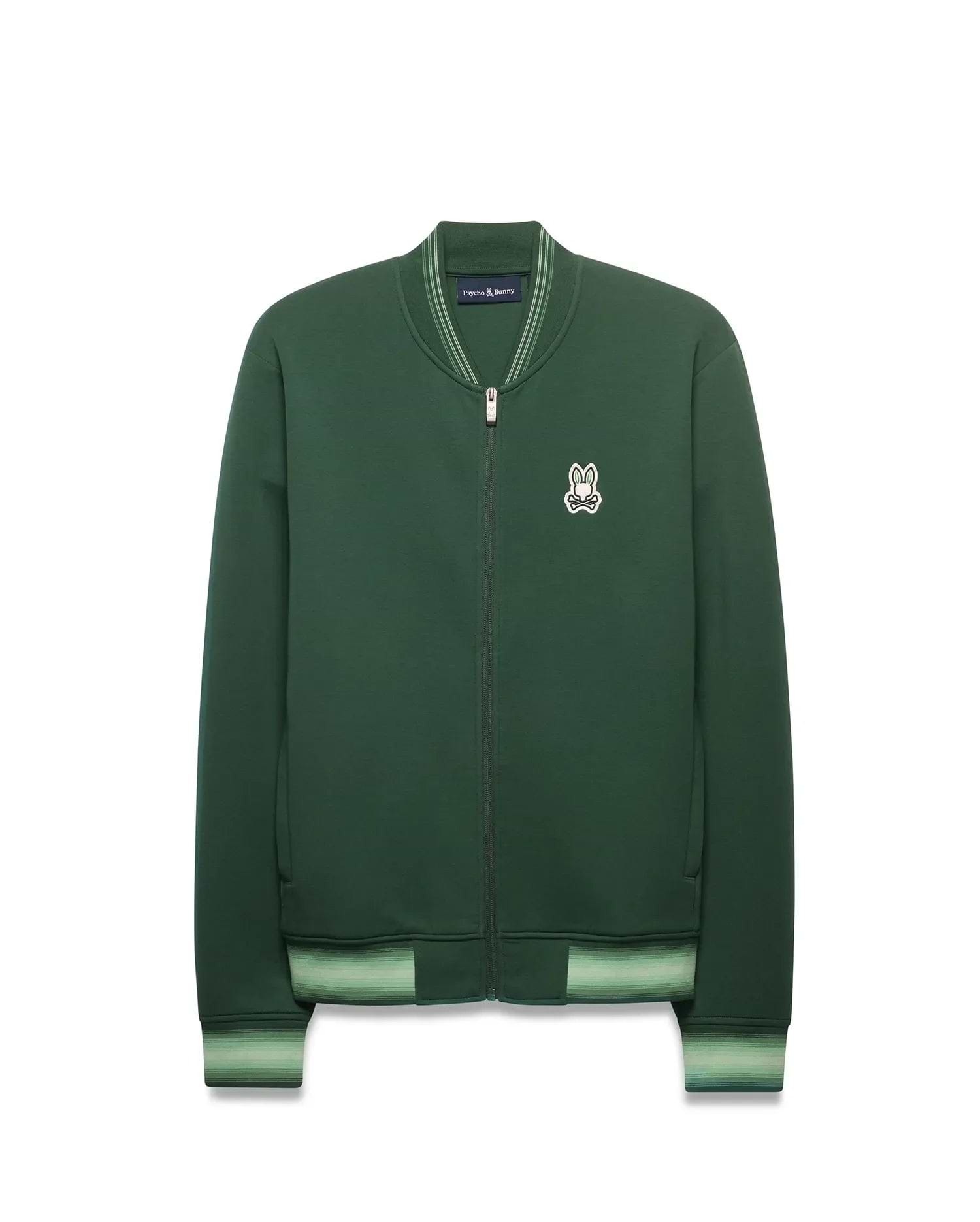 Mens Jaydon Track Jacket in forest green, featuring a full-zip closure, classic fit, smooth knit fabric, and a small embroidered white Psycho Bunny skull logo on the left chest. Ribbed collar and cuffs have light green stripes. (7)