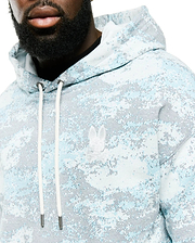 Men's Alfie All-Over Print Hoodie in light blue, white, and grey pixelated digital camo print, featuring a classic fit, soft knit fabric, and an embroidered white Psycho Bunny skull logo on the left chest with white drawstrings. (3)