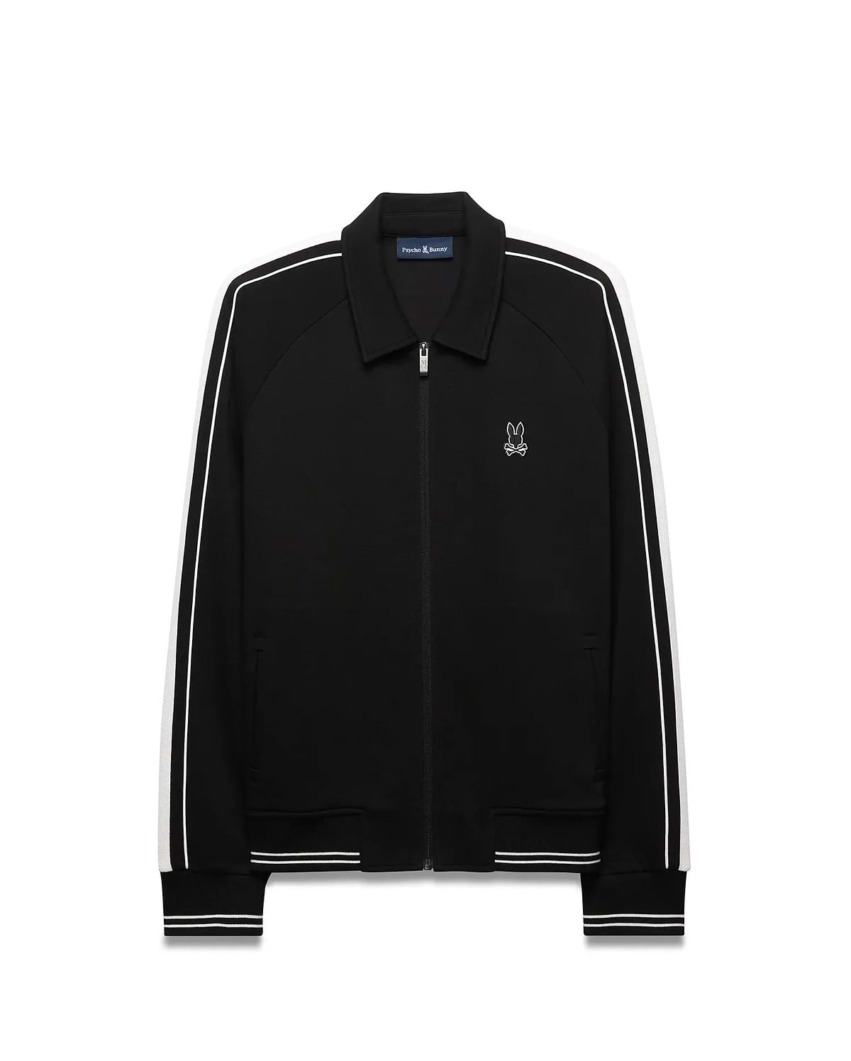 Mens Ceano Track Jacket, black smooth knit with a classic fit, featuring white double stripes on raglan sleeves, ribbed collar, cuffs, and hem, and a small embroidered white Psycho Bunny skull logo on the left chest.