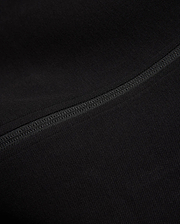 Black Mens Ceano Track Jacket featuring a smooth, finely textured knit fabric, accented by a prominent, precisely stitched flatlock seam running diagonally across the garment.