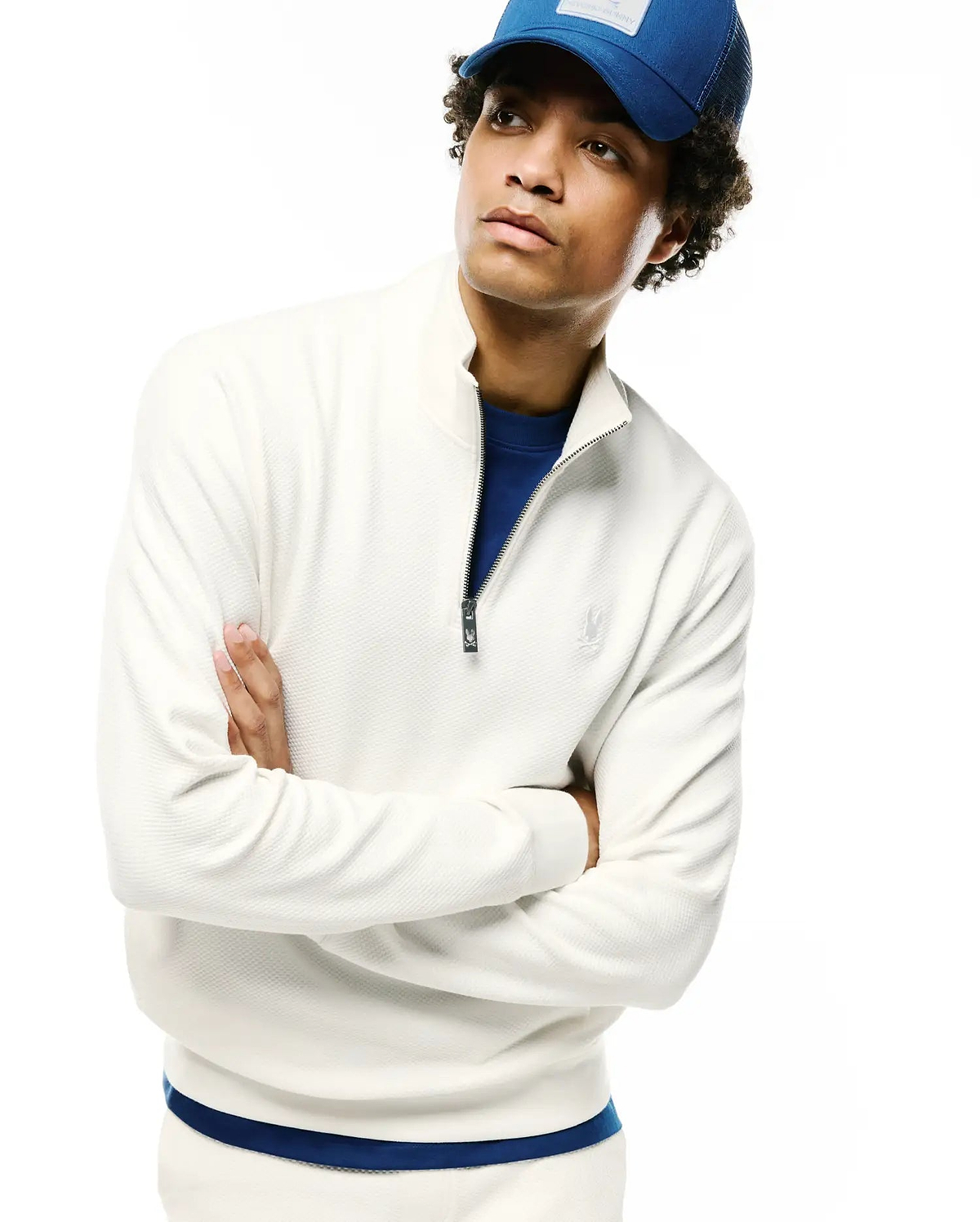 Mens Marc Textured 1/4 Zip in cream, featuring a classic fit, textured waffle knit fabric, a silver 1/4 zip closure with a dark Psycho Bunny logo pull, and a tonal embroidered left chest logo. (4)