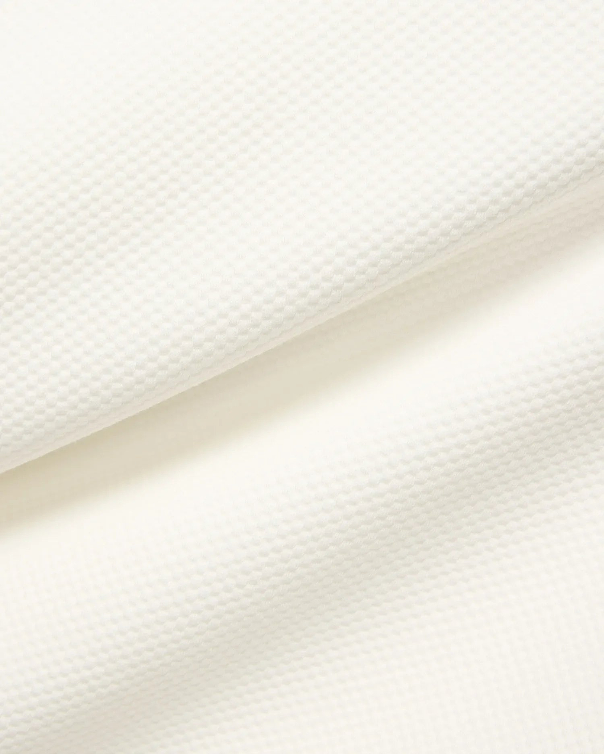 Mens Marc Textured 1/4 Zip in cream, showcasing a premium, subtly textured pique knit fabric with a fine, raised geometric pattern. (7)