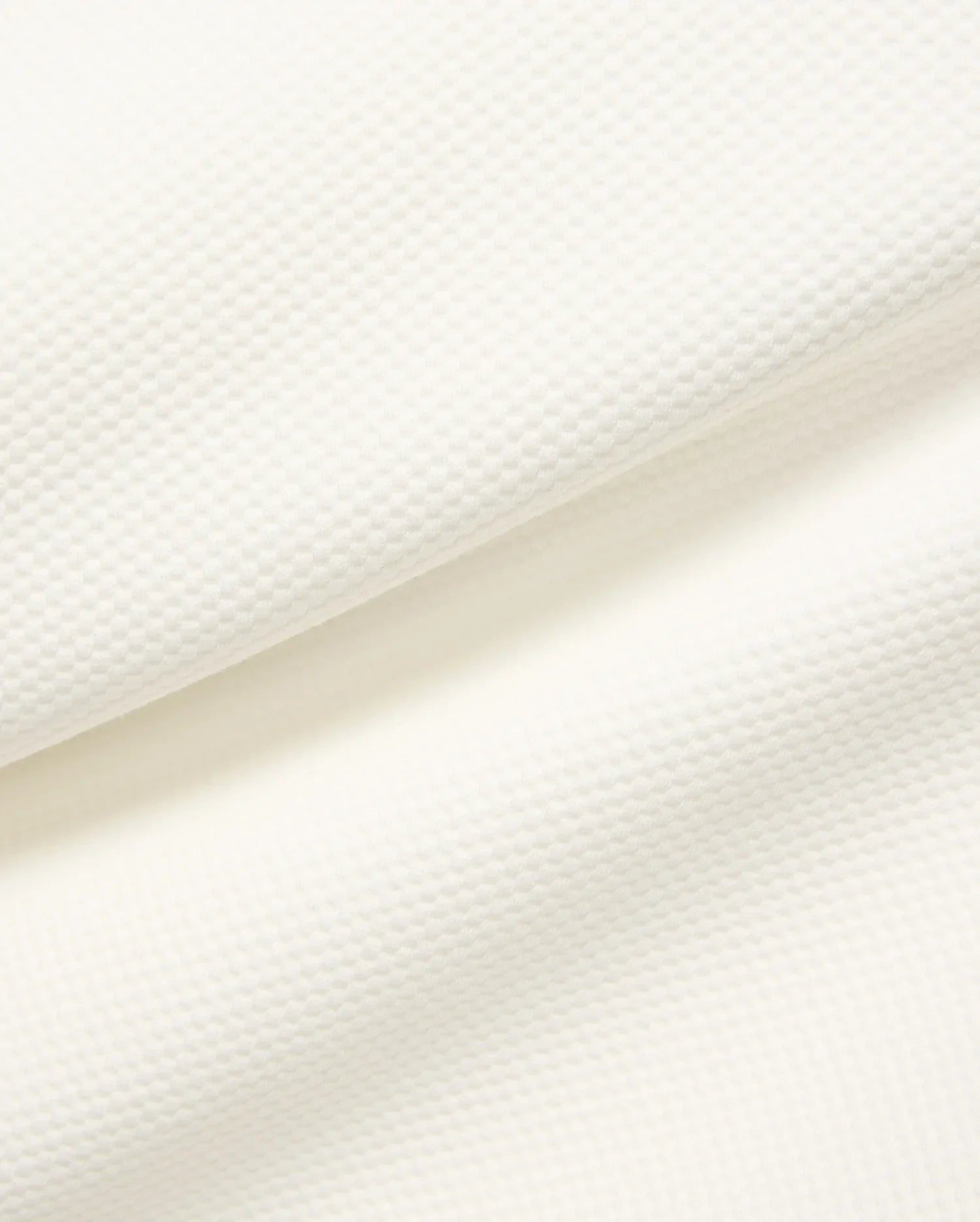 Mens Marc Textured 1/4 Zip in cream, showcasing a premium, subtly textured pique knit fabric with a fine, raised geometric pattern. (7)
