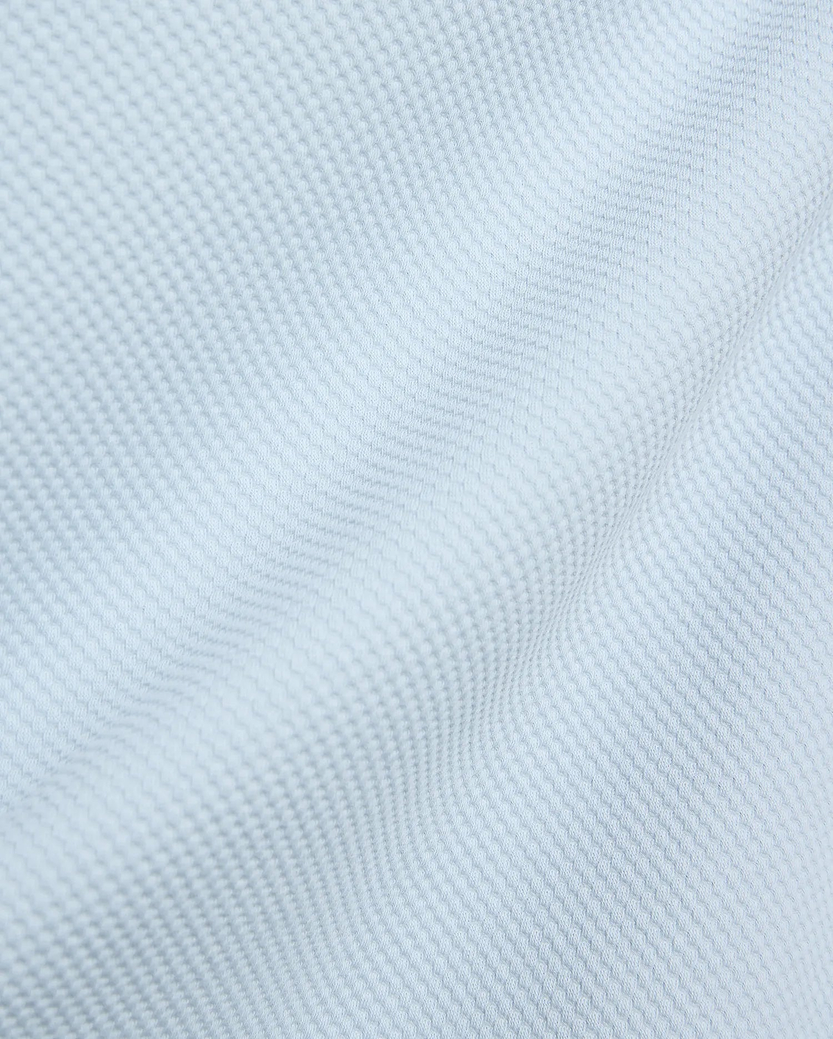 Mens Marc Textured 1/4 Zip in a soft light blue, crafted from a premium, refined pique-textured fabric with subtle folds, reflecting Psycho Bunny's elevated streetwear aesthetic.
