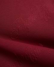 Mens Cedrick All Over Jacquard Crew in deep burgundy, featuring a subtle tone-on-tone jacquard knit pattern of the Psycho Bunny logo and brand name.