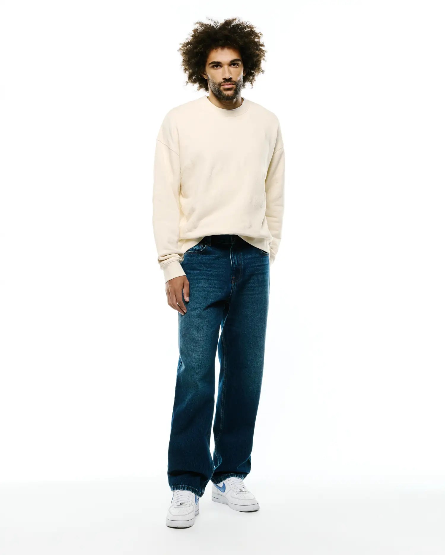 Mens Cedrick All Over Jacquard Crew in soft cream, a relaxed fit crewneck sweatshirt with a subtle all-over jacquard pattern and ribbed cuffs and hem, showcasing premium Psycho Bunny quality without a visible logo.