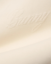 Mens Cedrick All Over Jacquard Crew in creamy off-white, featuring a subtle raised jacquard knit pattern of the word Bunny throughout the fabric.