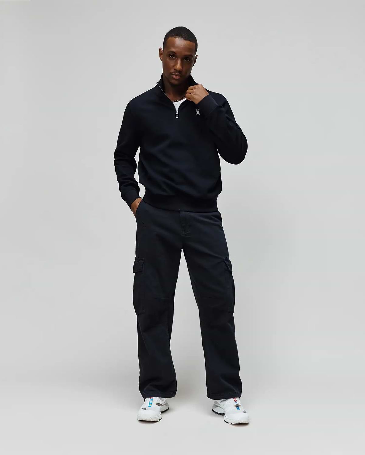 Mens Maxton Waffle 1/4 Zip in navy, featuring a waffle knit texture, classic fit, quarter-zip closure with a silver pull, and a small embroidered Psycho Bunny skull logo on the left chest.