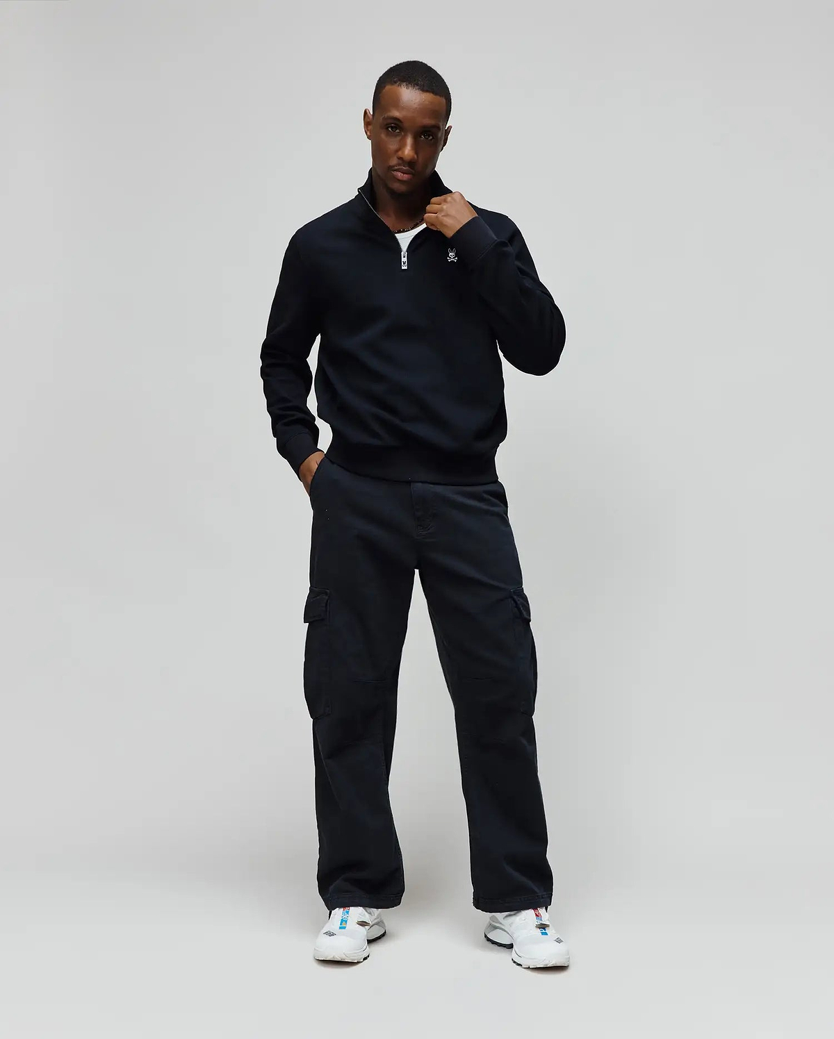 Mens Maxton Waffle 1/4 Zip in navy, featuring a waffle knit texture, classic fit, quarter-zip closure with a silver pull, and a small embroidered Psycho Bunny skull logo on the left chest.