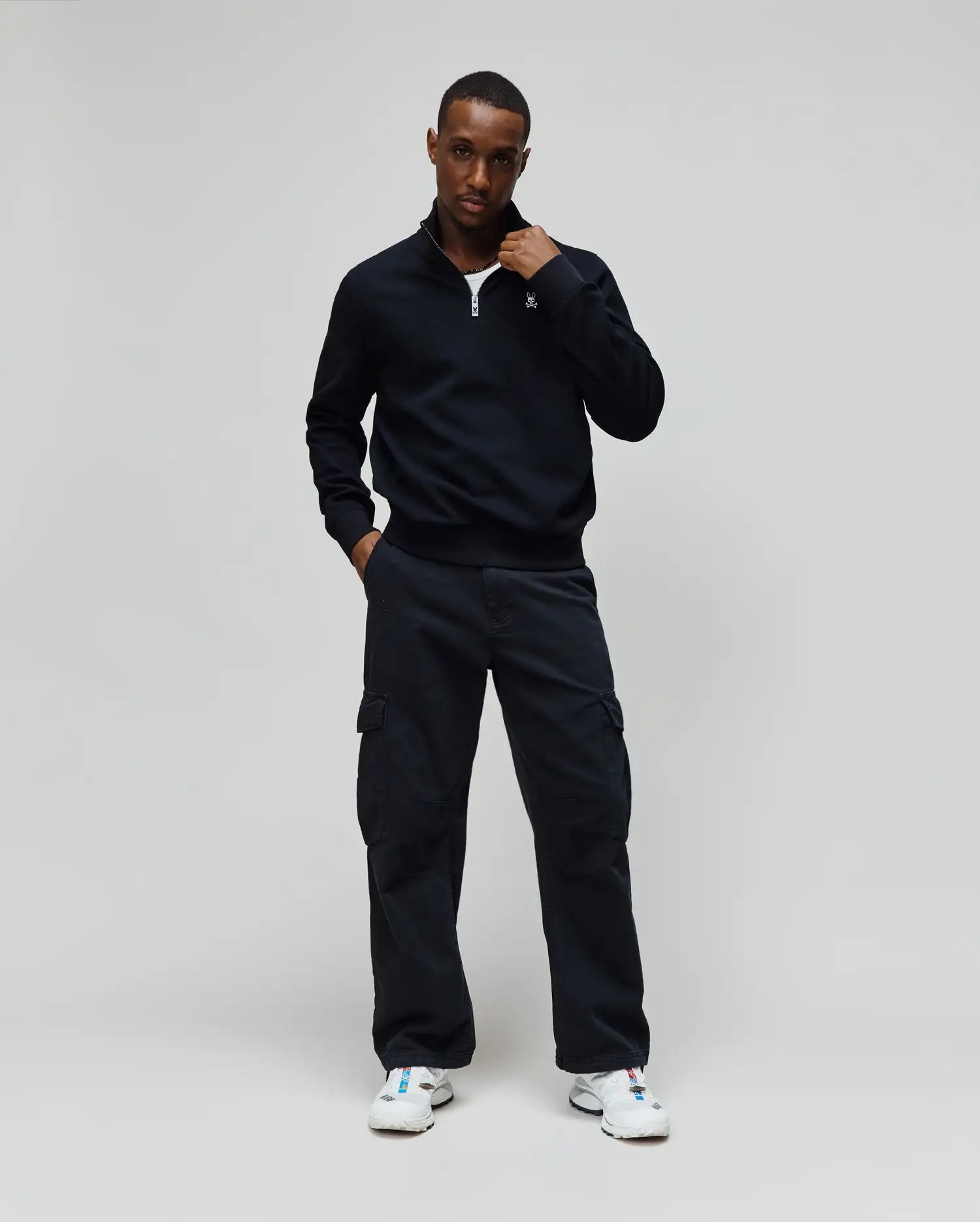 Mens Maxton Waffle 1/4 Zip in navy, featuring a waffle knit texture, classic fit, quarter-zip closure with a silver pull, and a small embroidered Psycho Bunny skull logo on the left chest.