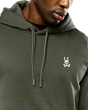 Mens Terrence Brushed Fleece Hoodie, dark olive green brushed fleece, with a white embroidered Psycho Bunny skull logo on the left chest and striped drawstrings with branded tips.