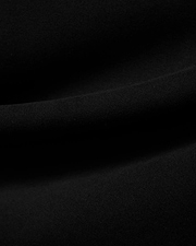 Men's Samson Quarter-Zip Sweater in classic black, crafted from a soft, smooth jersey knit fabric, showcasing its premium texture with subtle folds. (6)