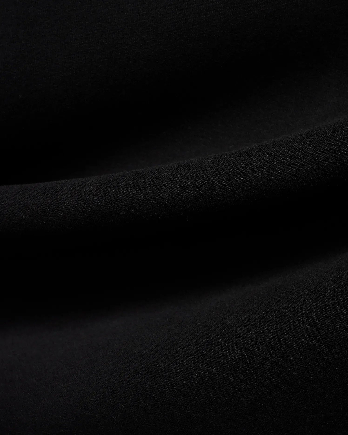 Men's Samson Quarter-Zip Sweater in classic black, crafted from a soft, smooth jersey knit fabric, showcasing its premium texture with subtle folds. (6)