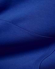 Vibrant royal blue Mens Nathaniel Relaxed Chest Hoodie, crafted from soft jersey fabric with visible seam stitching and a ribbed hem detail, embodying refined streetwear. (6)