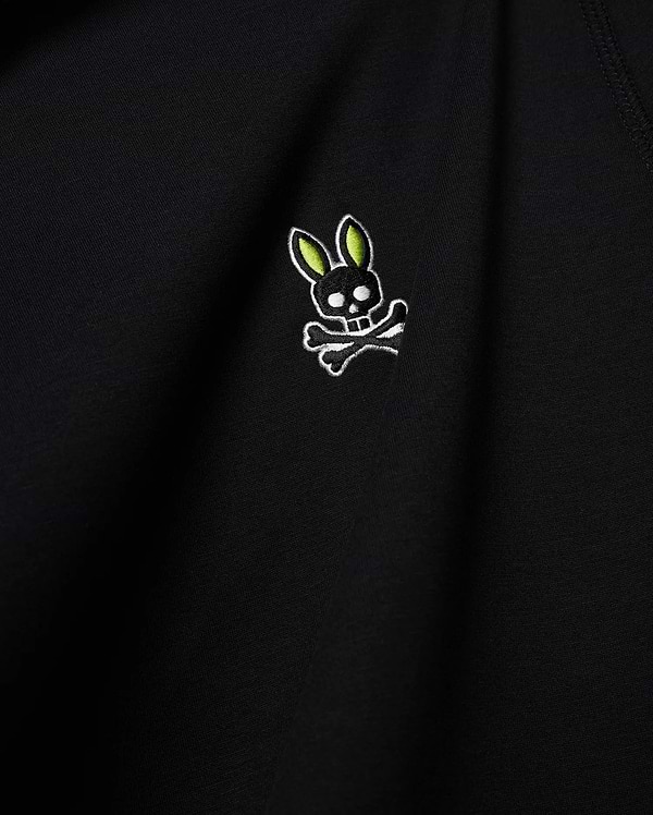 Mens Lex Hoodie, black smooth knit, featuring a small embroidered Psycho Bunny skull logo on the chest with vibrant neon green ears, black skull, and white outline details. (6)