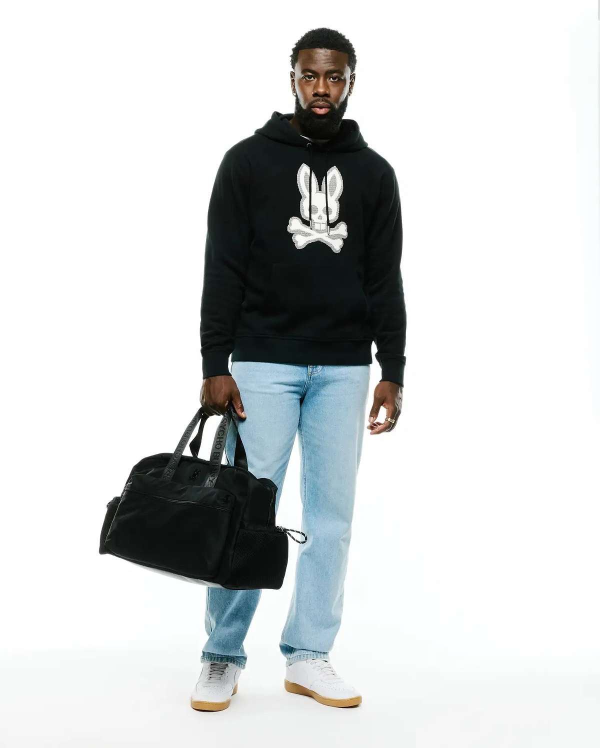Men's Samson Cotton Hoodie, a black relaxed fit french terry hoodie featuring a prominent white and grey textured Psycho Bunny skull and crossbones logo on the chest. (4)