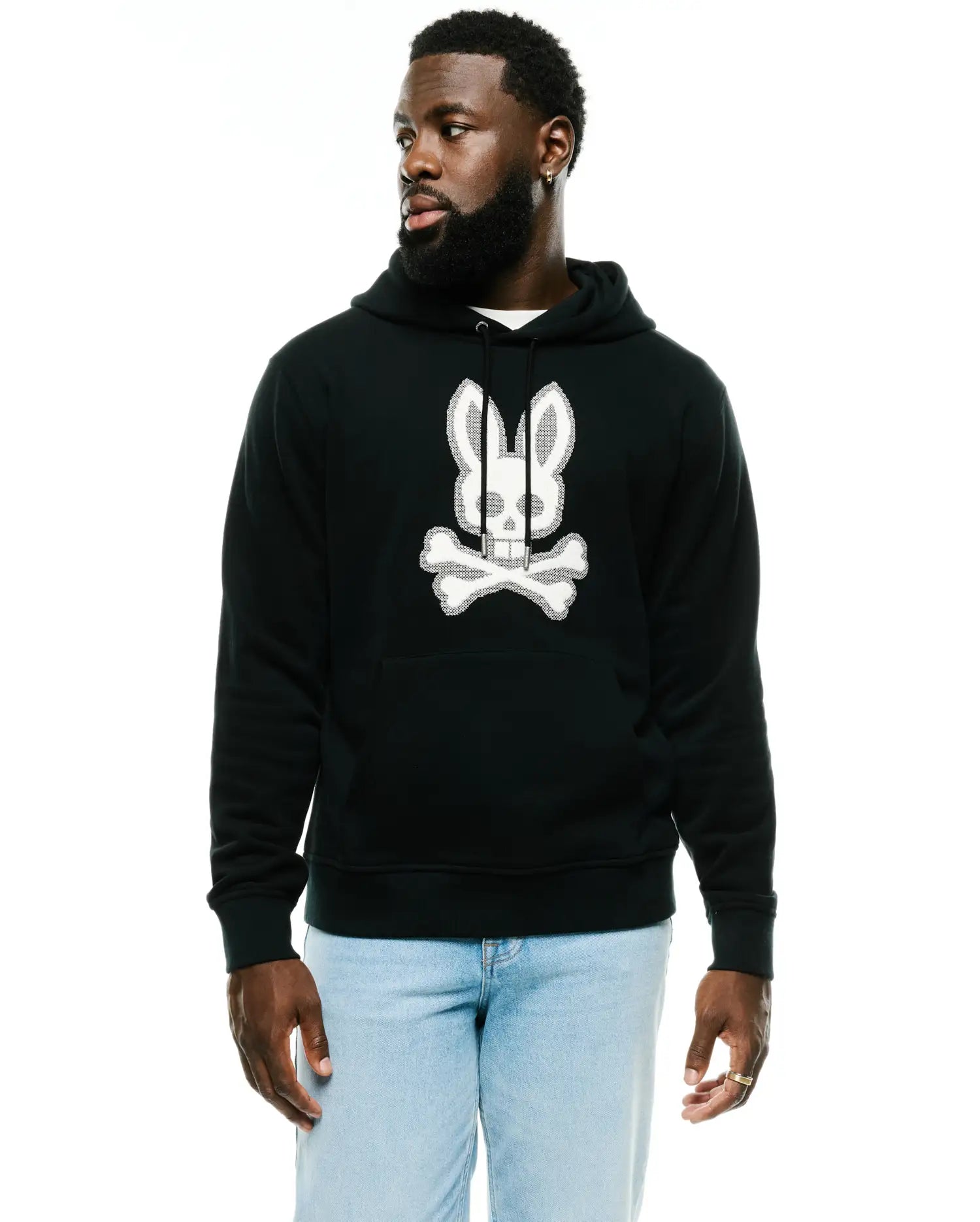 Men's Samson Cotton Hoodie, a black relaxed fit hoodie with a large, textured white Psycho Bunny skull logo on the chest, featuring a drawstring hood and kangaroo pocket. (1)