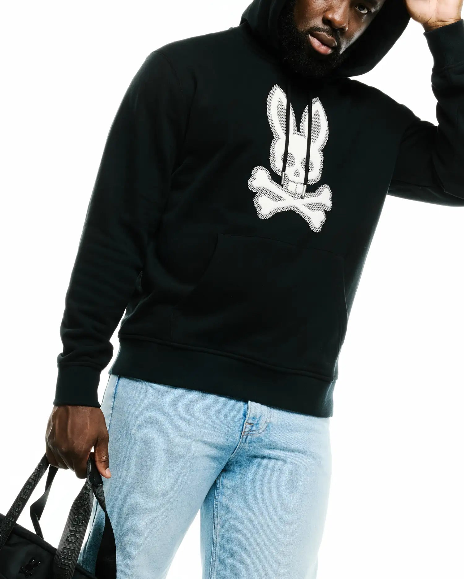 Men's Samson Cotton Hoodie, a black classic fit French terry hoodie featuring a large white embroidered Psycho Bunny skull and crossbones logo on the chest, drawstring hood, and kangaroo pocket. (3)