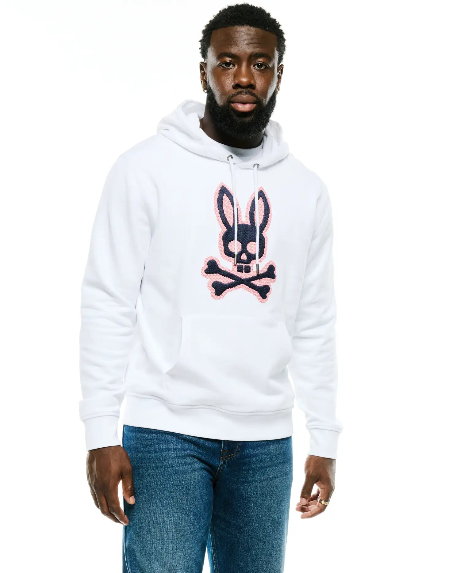 Men's Samson Cotton Hoodie, a classic fit white French terry hoodie with a large, central embroidered navy blue and pink Psycho Bunny skull and crossbones logo, drawstring hood, and kangaroo pocket. (1)