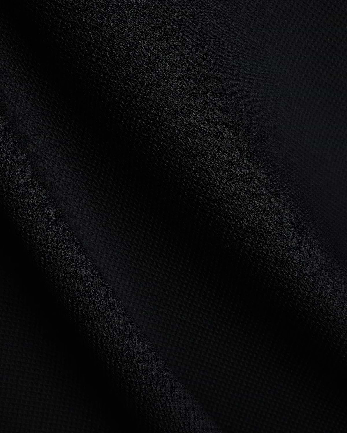Mens Tomas Waffle Hoodie, a luxurious black waffle knit fabric, showcasing the premium texture and quality expected from Psycho Bunny refined streetwear.