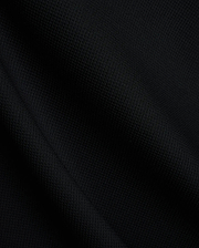 Mens Tomas Waffle Hoodie, a luxurious black waffle knit fabric, showcasing the premium texture and quality expected from Psycho Bunny refined streetwear.