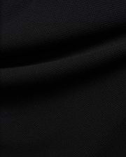 Premium black Tomas Waffle 1/4 Zip, showcasing its rich, deep black fabric with a prominent, textured waffle knit pattern and soft, flowing folds, embodying Psycho Bunny's refined streetwear.